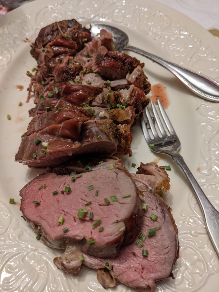 Cooked beef tenderloin on a plate